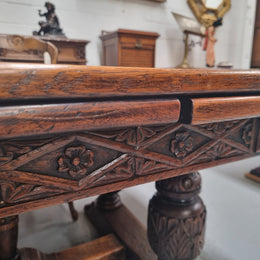 Renaissance style Oak extension table with parquetry top and twin pedestal base. The table extends by pulling out an extension leaf either side making it 287 cm long. Sourced from France and in good original detailed condition.