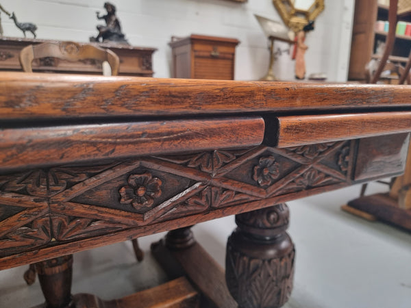 Renaissance style Oak extension table with parquetry top and twin pedestal base. The table extends by pulling out an extension leaf either side making it 287 cm long. Sourced from France and in good original detailed condition.