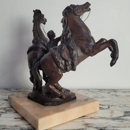 French Art Deco cold painted bronze metal marley horses style statue on a marble base. It is in good condition.