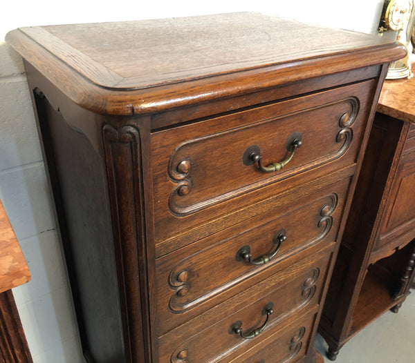 Antique French Oak Louis XV style four drawer bedside cupboard/side cupboard. In good original detailed condition. Circa 1910.