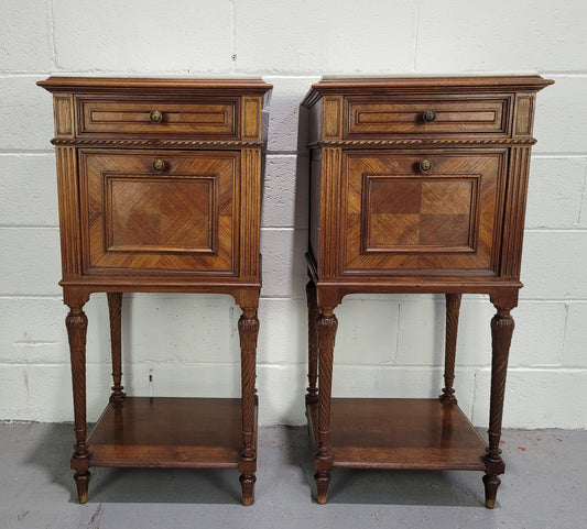 Pair parquetry Walnut bedside cabinets with white inset marble tops. In good original detailed condition.
