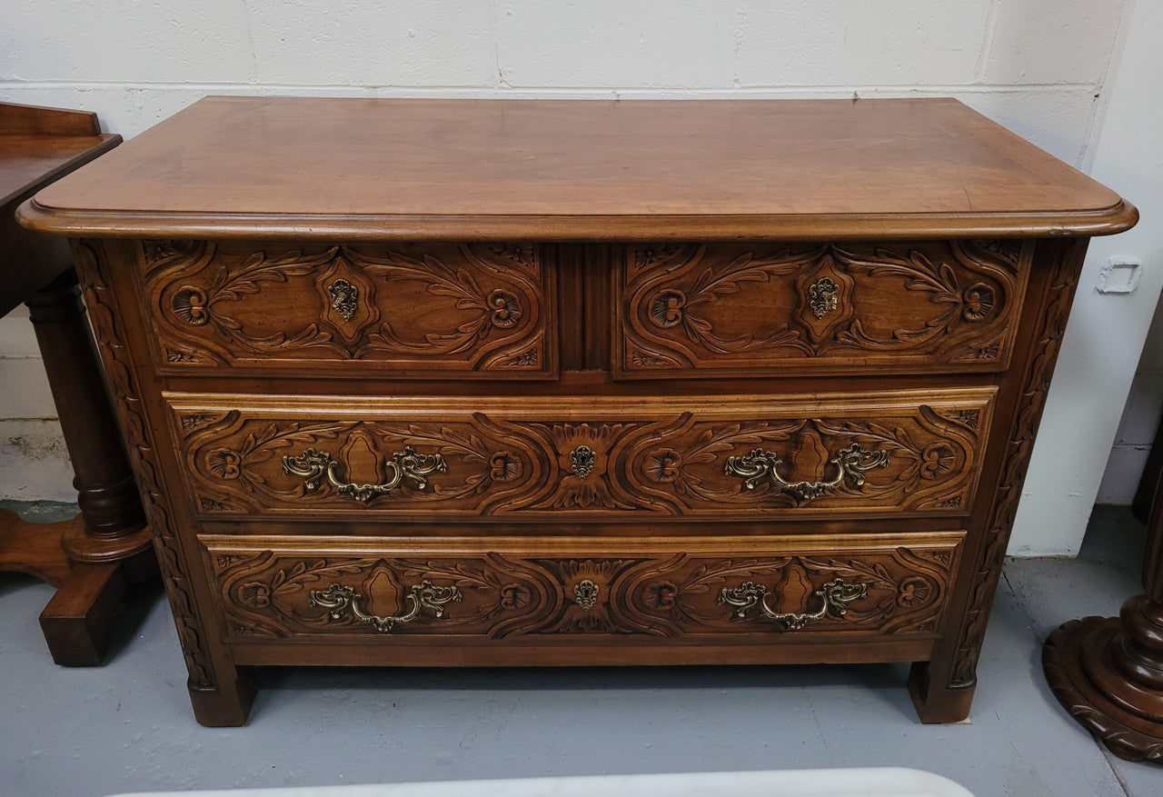 French Cherrywood Louis XIV style wooden topped chest of four drawers. It has been sourced from France and is in good original detailed condition.