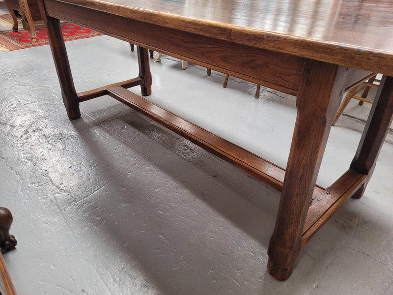 French oak stretcher base refectory table. It has been sourced from France and is in good original condition. Please see pictures to form part of the description.