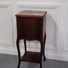 French Rosewood inset marble top single bedside cabinet with one drawer and one cupboard on elegant legs. Would also make a practical and stunning table lamp. It is in good original detailed condition.