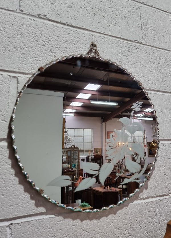 Vintage Art Deco round wall mirror with pie crust edge and etched floral design . In good condition, please see photos .