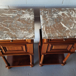 Pair of Henry II style Walnut bedside cabinets with a marble top. Circa 1920s and in good original condition.