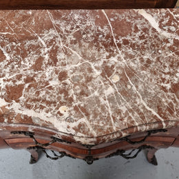 Antique French Louis XV style compact three drawer marble top commode with marquetry inlay and ormolu mounts. Sourced from France and in good original detailed condition.