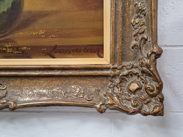 French signed oil on canvas depicting sunflowers in an attractive gilt frame. It is in good original detailed condition and has been sourced from France.