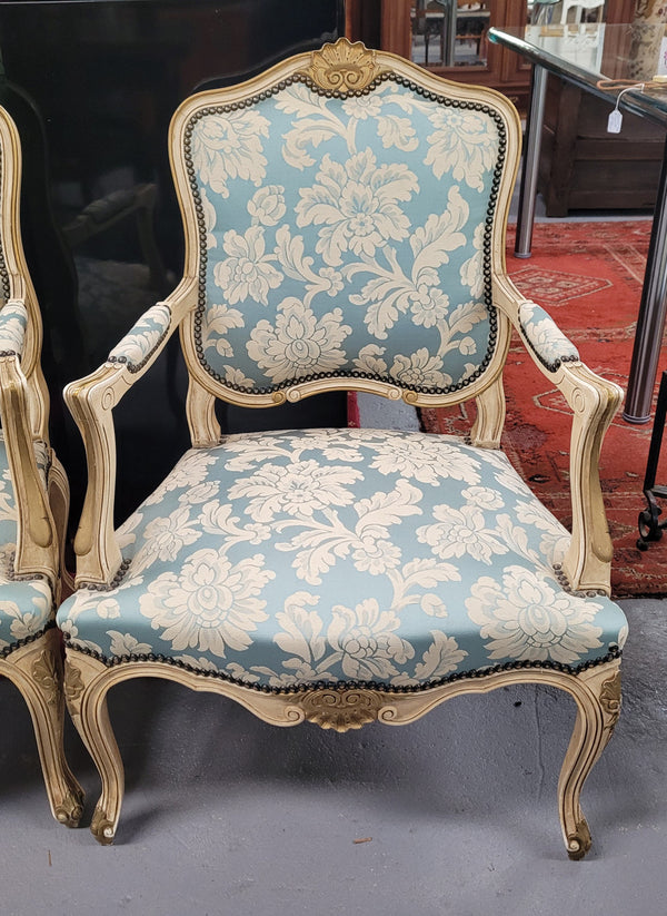 A beautiful pair of French upholstered Louis XV painted style armchairs, with lovely carved detail and they are very comfortable to sit in. These chairs are in great original condition.
