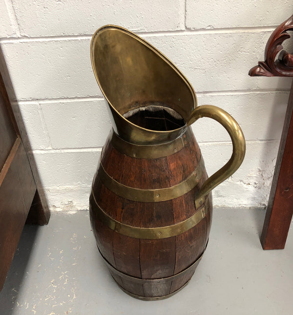 French Oak with Copper large wine jug. In good original detailed condition.