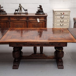Renaissance style Oak extension table with parquetry top and twin pedestal base. The table extends by pulling out an extension leaf either side making it 287 cm long. Sourced from France and in good original detailed condition.