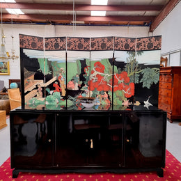 French Art Deco sideboard with a custom black lacquer finish.  Beautiful serpent shaped front with four cupboards with working locks and includes to working keys. It is in original condition.