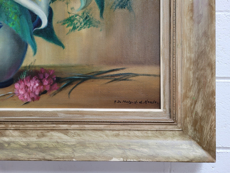 Signed and sourced in France a vintage oil on board still life of white lillie's in vase. In a beauitufl frame and it is in good original detailed condition.