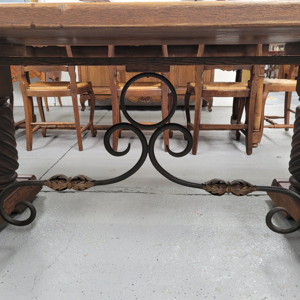 Amazing French Oak Spanish Renaissance style dining table with beautiful decorative iron work. It has been sourced from France and can comfortable seat 8- 10 people. Sourced from France and is good original detailed condition.