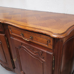 French Oak Louis XV style three drawer three door parquetry top sideboard. It has been sourced from France and is in good original detailed condition.