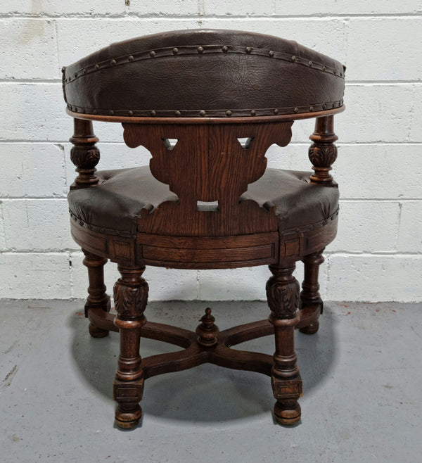 Henry 2nd style French Oak leather library chair with amazing detailed carvings. It is very comfortable to sit in and the leather is in good original condition.