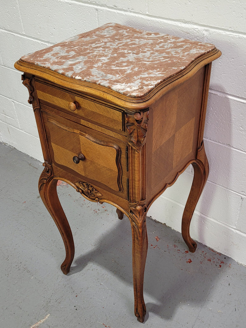 Single French Louis XV style Walnut inset marble top bedside. It has one drawer and one cupboard. It is in good original detailed condition.