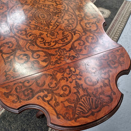 Fabulous marquetry inlaid side table with marquetry extensions and one drawer. Stunning side table or small ladies desk.