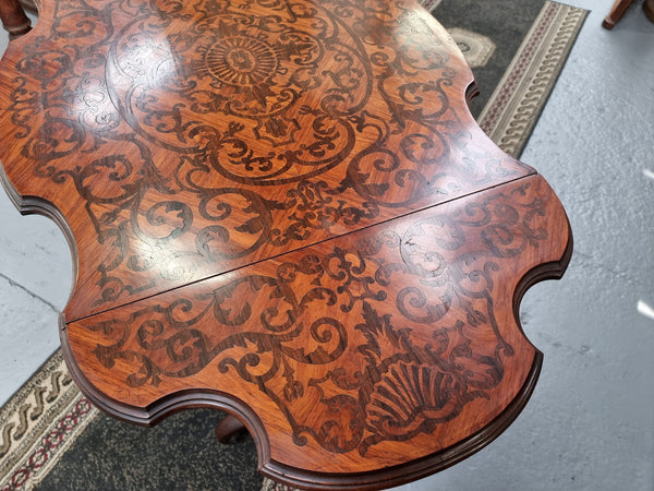 Fabulous marquetry inlaid side table with marquetry extensions and one drawer. Stunning side table or small ladies desk.