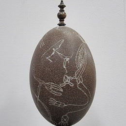 Superbly carved Emu egg on a emu metal and ebony base. It depicts an Aboriginal hunting scene and dreaming's. It is in good original condition, please view photos as they help form part of the description.