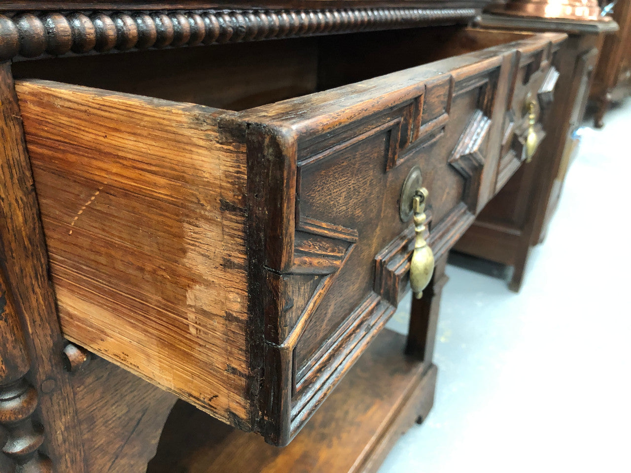 Fabulous Antique Tudor style Oak kitchen dresser with two drawers and two shelves. It is in good original detailed condition.