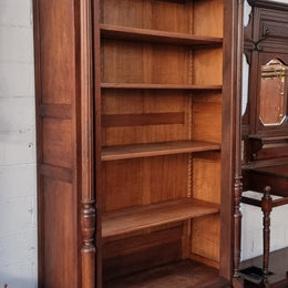 Henry II style 19th century walnut open bookcase with drawer which was originally an armoire now converted to a bookcase. It comes with four adjustable shelves. Is in good detailed condition.