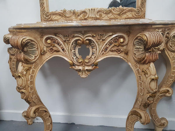 Beautifully carved Italian Rococo style painted console/hall table and mirror. An amazing coloured marble top showing sections of gold veins and is in good condition. Mantle mirror is retaining it's original mirror and showing ages spots.