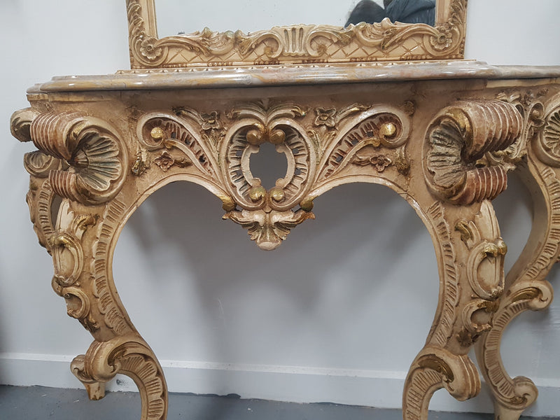 Beautifully carved Italian Rococo style painted console/hall table and mirror. An amazing coloured marble top showing sections of gold veins and is in good condition. Mantle mirror is retaining it's original mirror and showing ages spots.