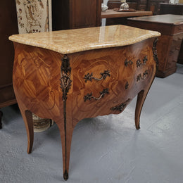 An elegant French Louis XV style kingwood two drawer commode with beautiful decorative inlay and ormolu mounts. Stunning coloured marble top and is in good original detailed condition.