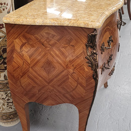 An elegant French Louis XV style kingwood two drawer commode with beautiful decorative inlay and ormolu mounts. Stunning coloured marble top and is in good original detailed condition.