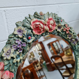 Beautifully decorated Barbola round bevelled edge mirror. In good original condition.