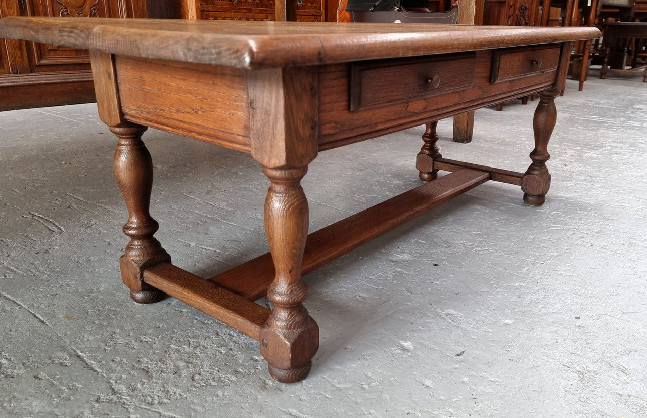 Fabulous Rustic French Oak coffee table with two drawers. It is in good original detailed condition.