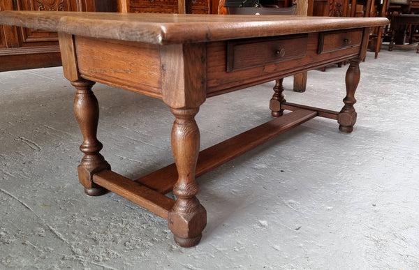 Fabulous Rustic French Oak coffee table with two drawers. It is in good original detailed condition.