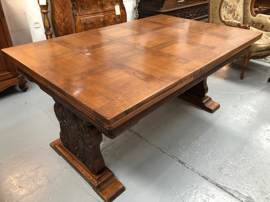 A beautiful French oak, Spanish style parquetry top extension table, with amazing carving and lovely details in very good condition.