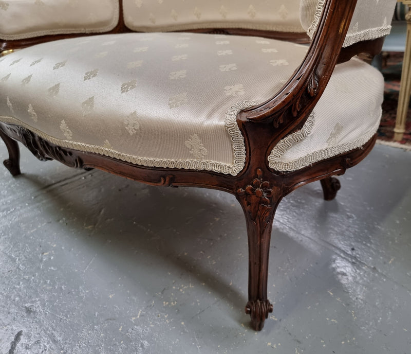 Pretty French Louis XV style small Walnut settee with very good upholstery. Sourced from France and in good original condition, please view photos of the upholstery as it helps form part of the description.