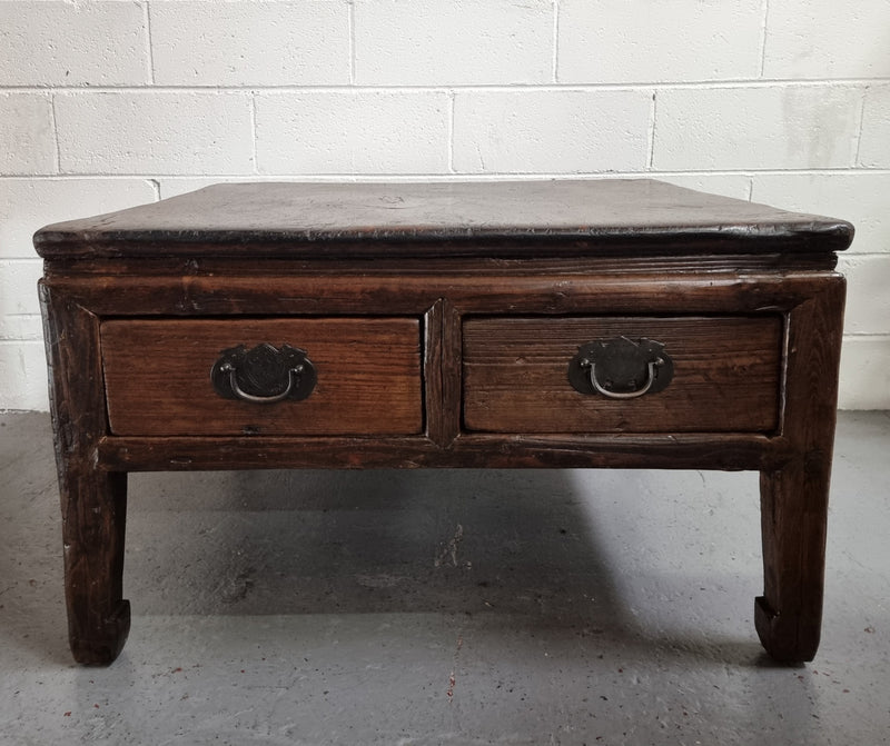 Square Elm coffee table with oriental legs and two long drawers.  Beautifully finished and in good original condition. It has been sourced from France.