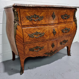Attractive French marble top Louis XV style three drawer commode with decorative ormolu mounts. In good original detailed condition.