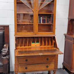 Stunning Art Deco secretary desk bookcase with heaps of storage space. It has a leathered writing area, bookcase with three adjustable shelves and three large drawers at the bottom. It has been sourced locally and in good original detailed condition.