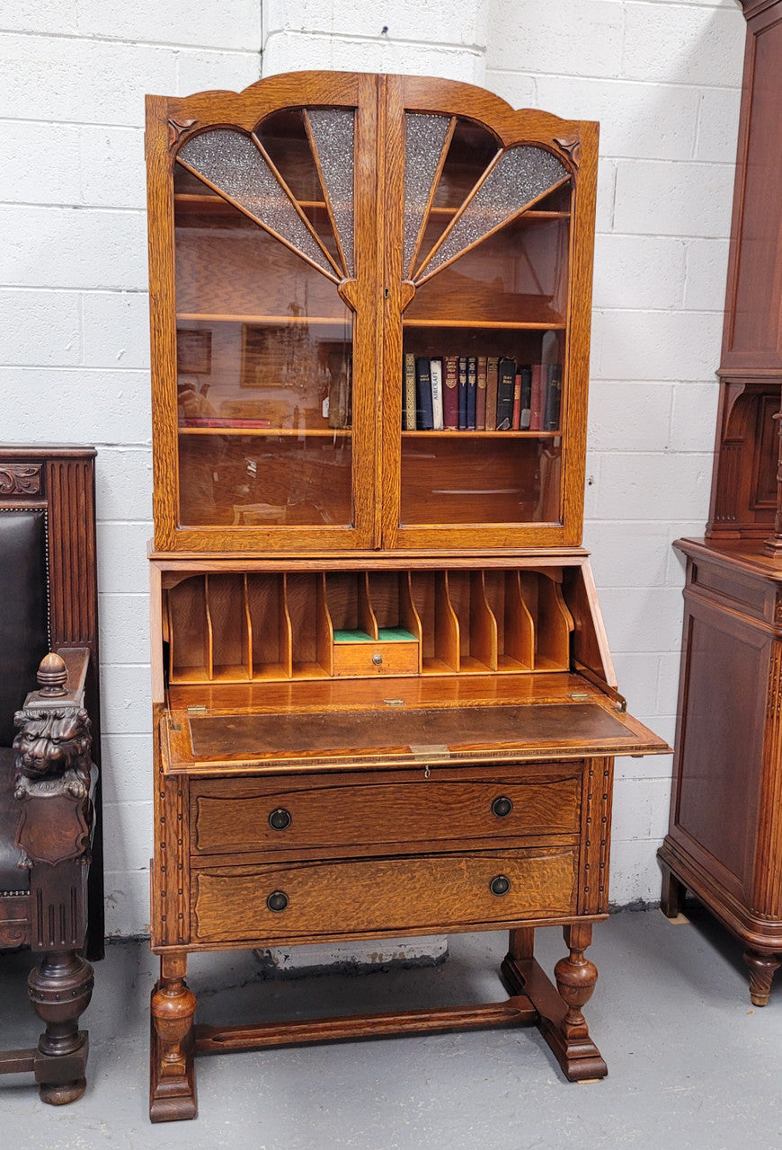 Stunning Art Deco secretary desk bookcase with heaps of storage space. It has a leathered writing area, bookcase with three adjustable shelves and three large drawers at the bottom. It has been sourced locally and in good original detailed condition.