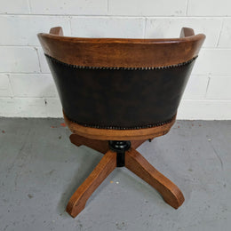 Antique French Oak newly upholstered "swivel action" office desk chair. In very good condition and very comfortable to sit in.