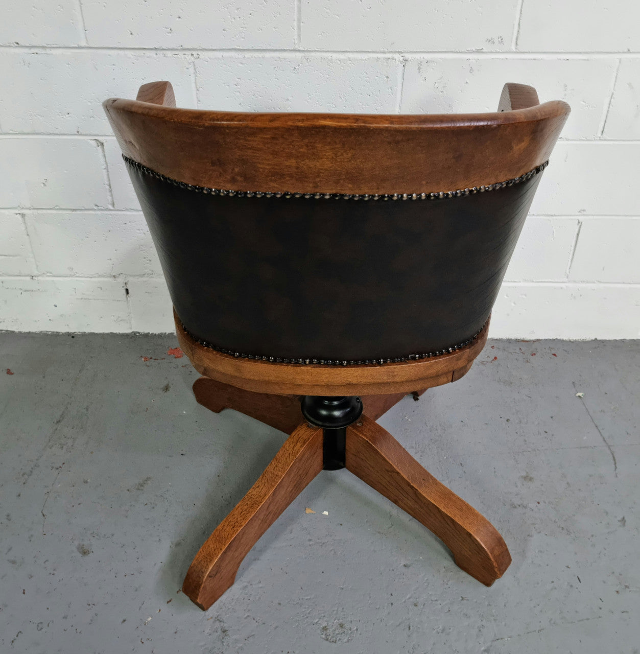 Antique French Oak newly upholstered "swivel action" office desk chair. In very good condition and very comfortable to sit in.