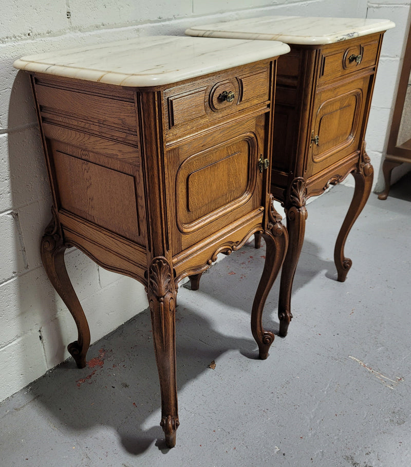 Pair of Louis XV style bedside cabinets with beautiful marble tops and one drawer and single cupboard for all your storage needs. In good original detailed condition.