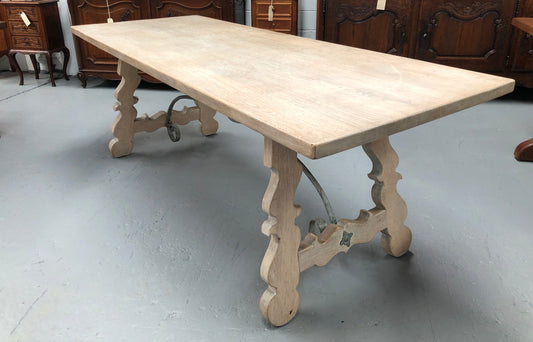 Limed French Oak Farmhouse table with decorative iron base. In good original detailed condition.