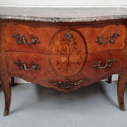 Beautiful French walnut Louis XV style two drawer commode. With a lovely floral marquetry inlaid design and marble top. It is in good original detailed condition.