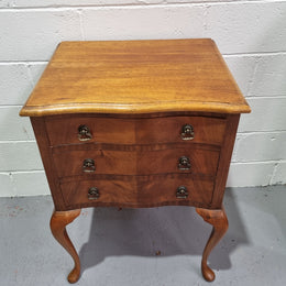 Antique Queen Anne style figured Walnut Bedside cabinet with 3 drawers. It is in good original detailed condition.