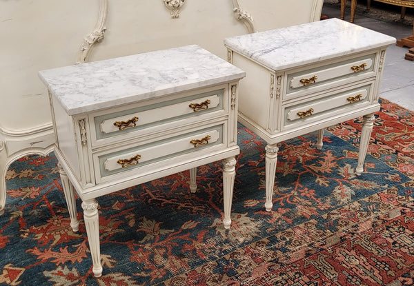 Attractive pair of Vintage French Louis 16th style two drawer marble topped bedsides. They have been sourced from France and are in good original condition.