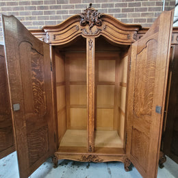 Amazing French Oak Louis XV style four door armoire. Plenty of storage space and beautifully carved throughout. In good original detailed condition and sourced from France. Please contact us for further photos.