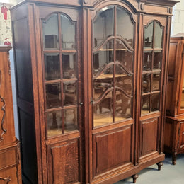 Late 19th Century French Oak three door bookcase. It has fully adjustable shelfs and is in good original detailed condition.