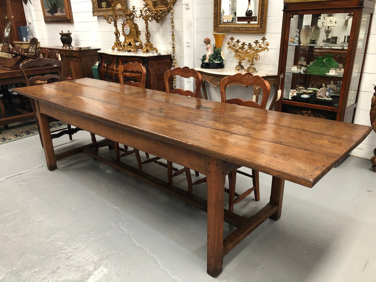 19th Century French three meter Farmhouse table with a beautiful original rustic top. In very good original detailed condition.