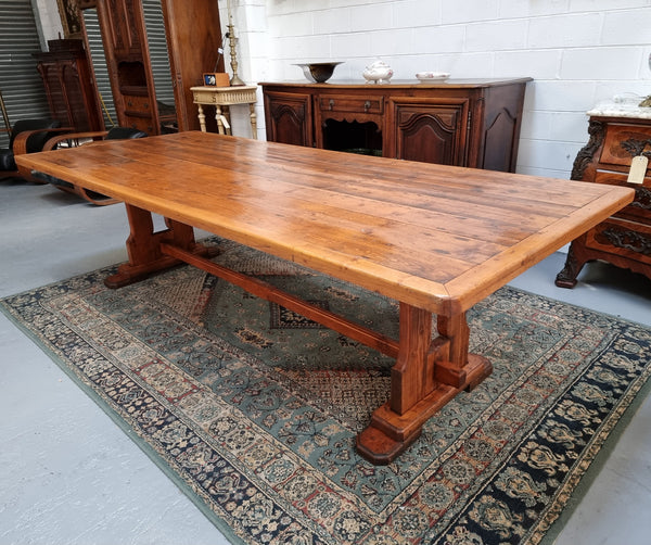 Reclaimed Pine and Oregon stretcher base dining table. The top has an amazing patina and character. Can very comfortable seat 12 and is in good original detailed condition .